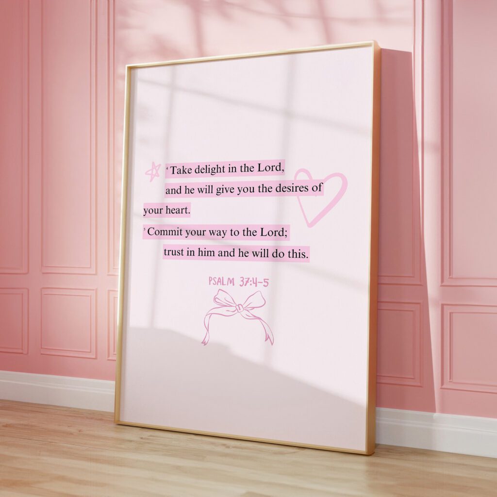 Framed inspirational psalm with decorative elements on pink wall.