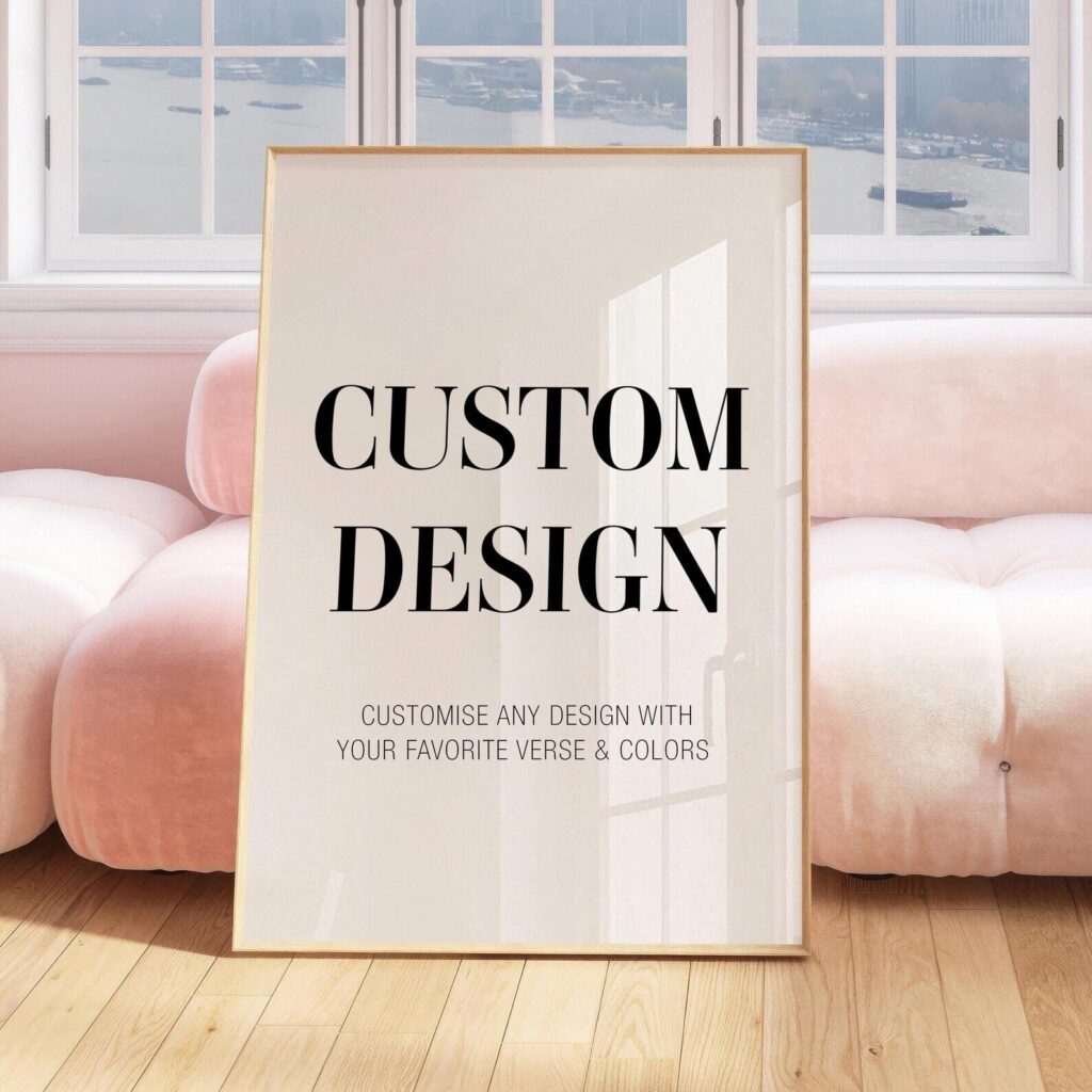 A poster leaning on a pink couch reads: Custom Design. Customise any design with your favorite verse & colors.