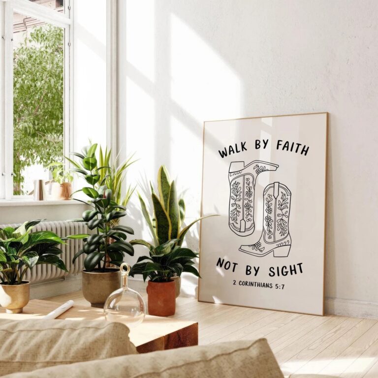 Bright room with plants and a framed poster reading Walk by faith, not by sight. 2 Corinthians 5:7.